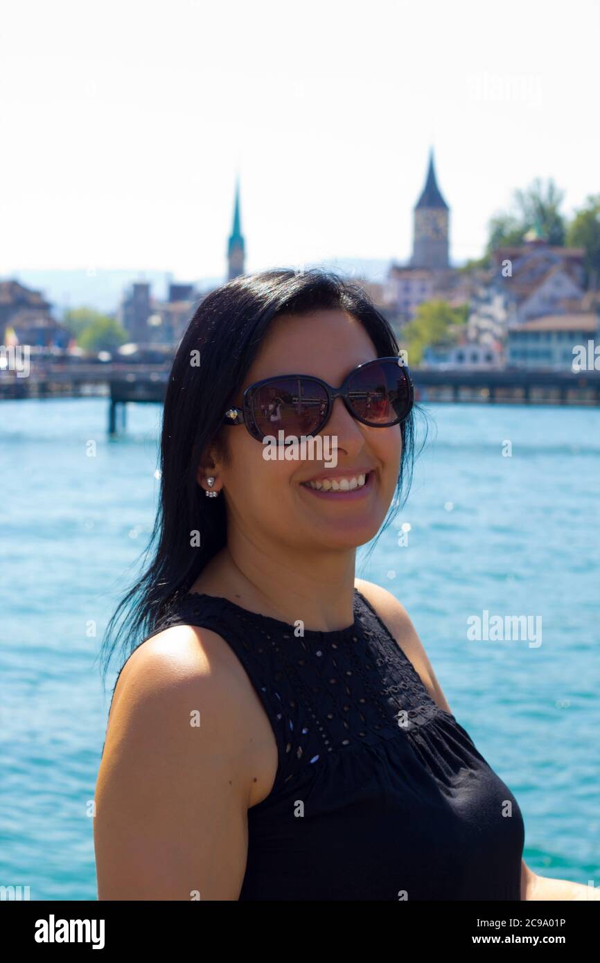Beautiful young woman in Zürich city in Switzerland Stock Photo