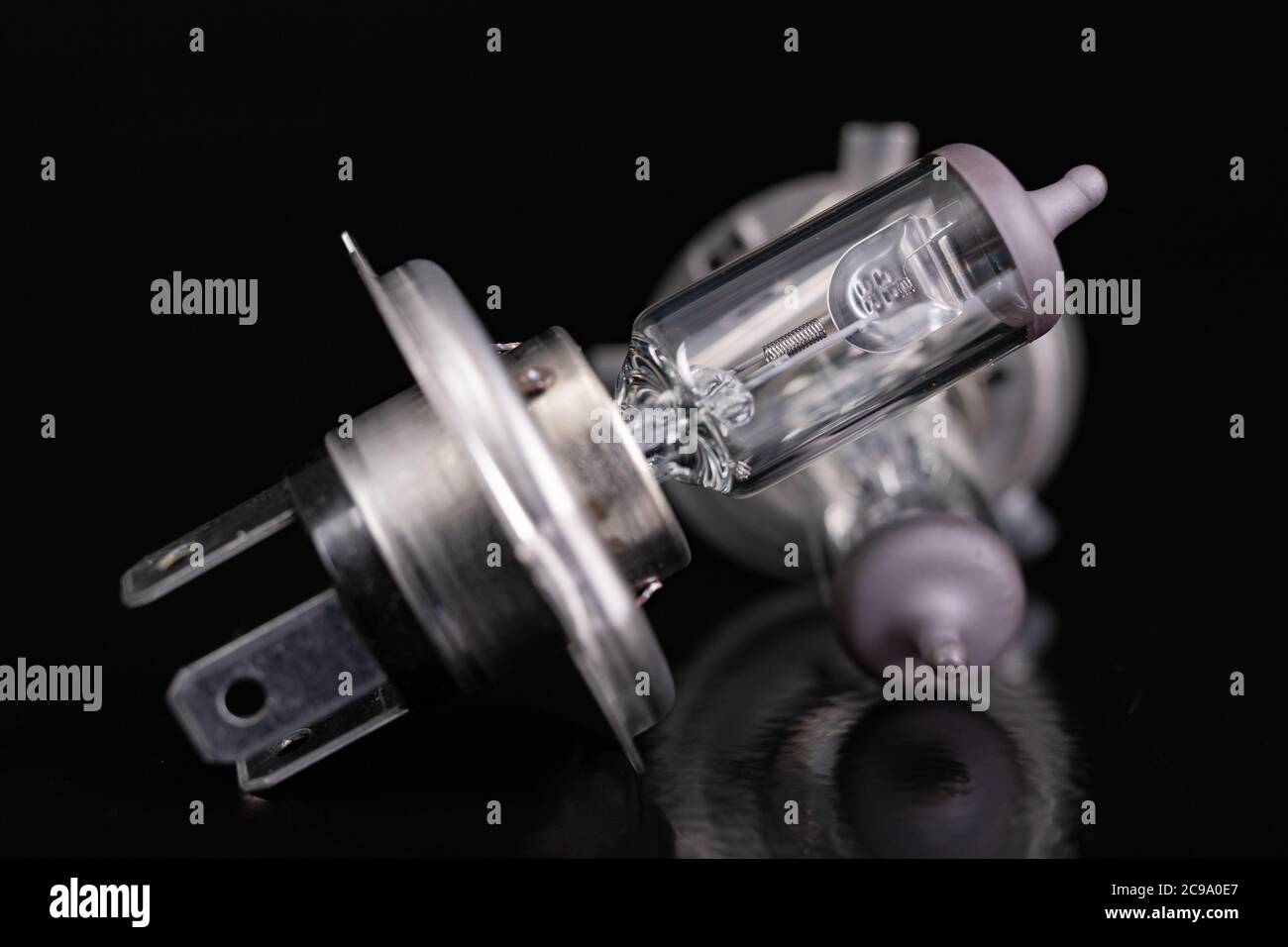https://c8.alamy.com/comp/2C9A0E7/blown-car-light-bulbs-replaceable-car-accessories-for-headlights-dark-background-2C9A0E7.jpg