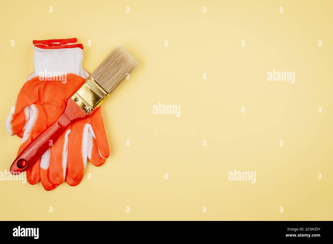 House painter tool on a yellow background. Stock Photo