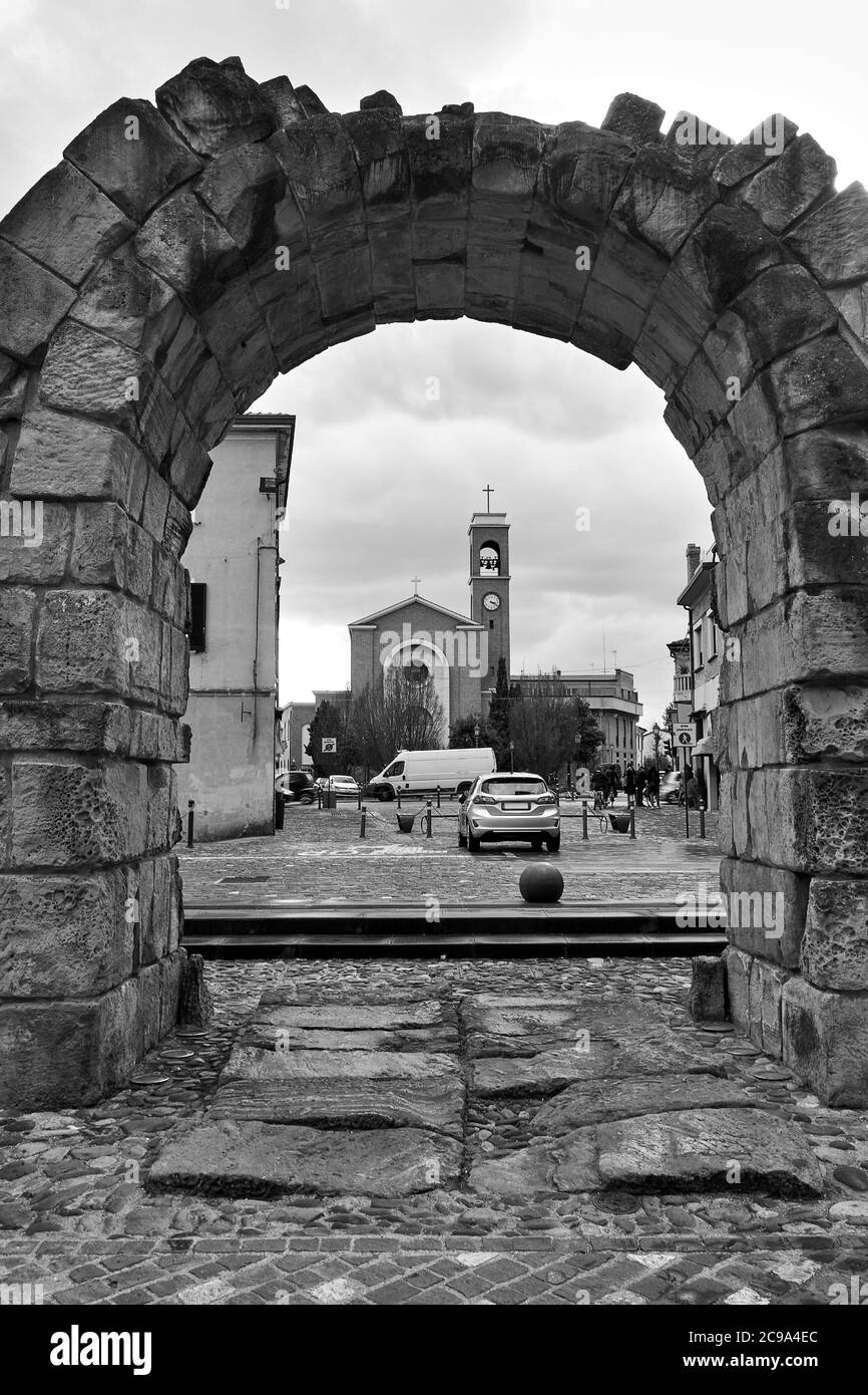 Ancient roman arch in Rimini, Italy. Black and white italian cityscape Stock Photo