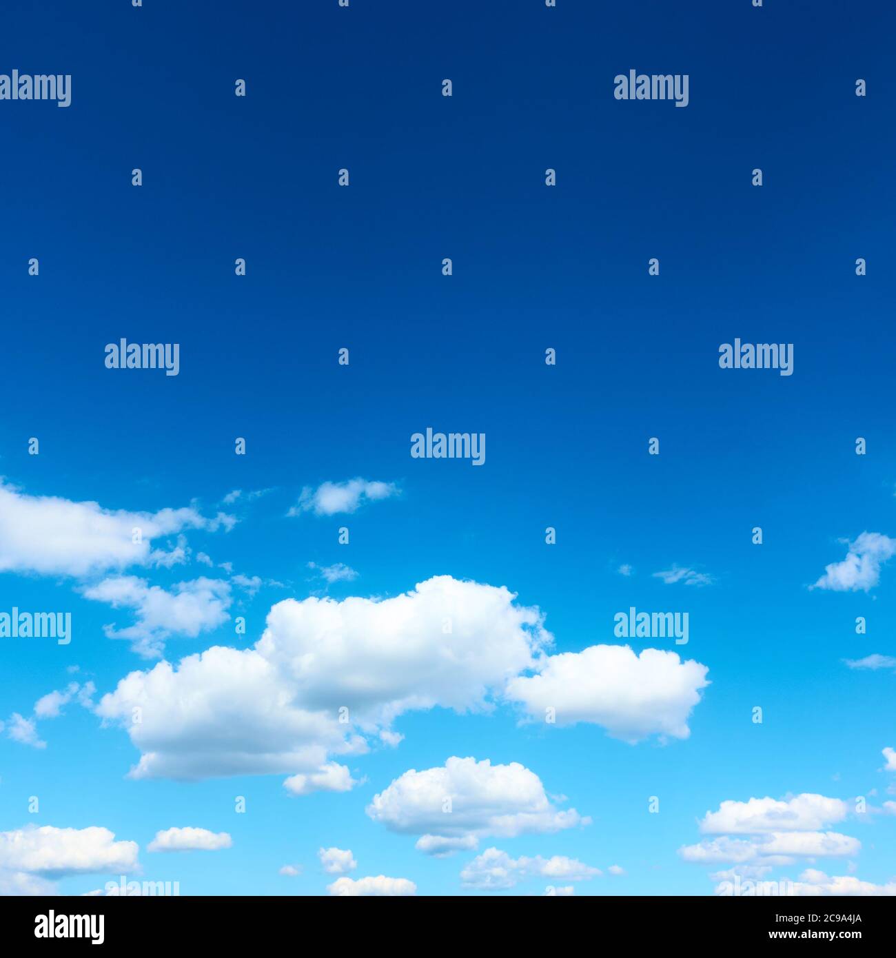 Dark blue sky with white clouds, may be used as background Stock Photo