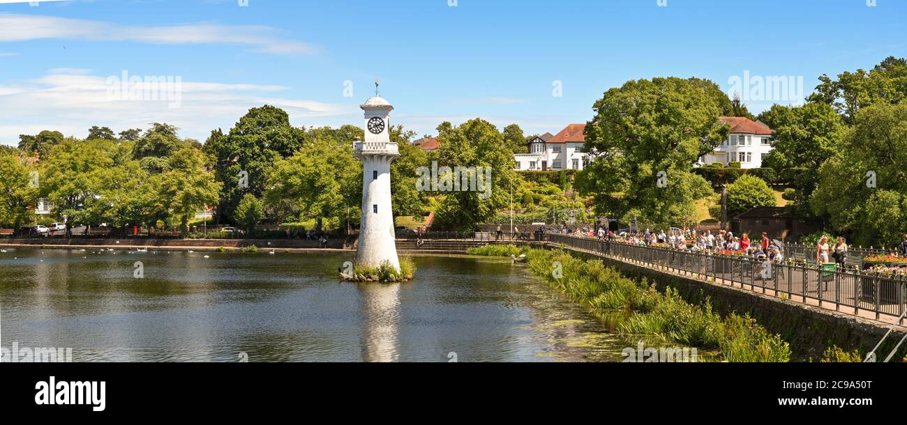 Cardiff, Wales - July 2020: Panoramic view of Roath Park Lake. The clock tower is a memorial to Captain Scott who left Cardiff for Antarctica. Stock Photo