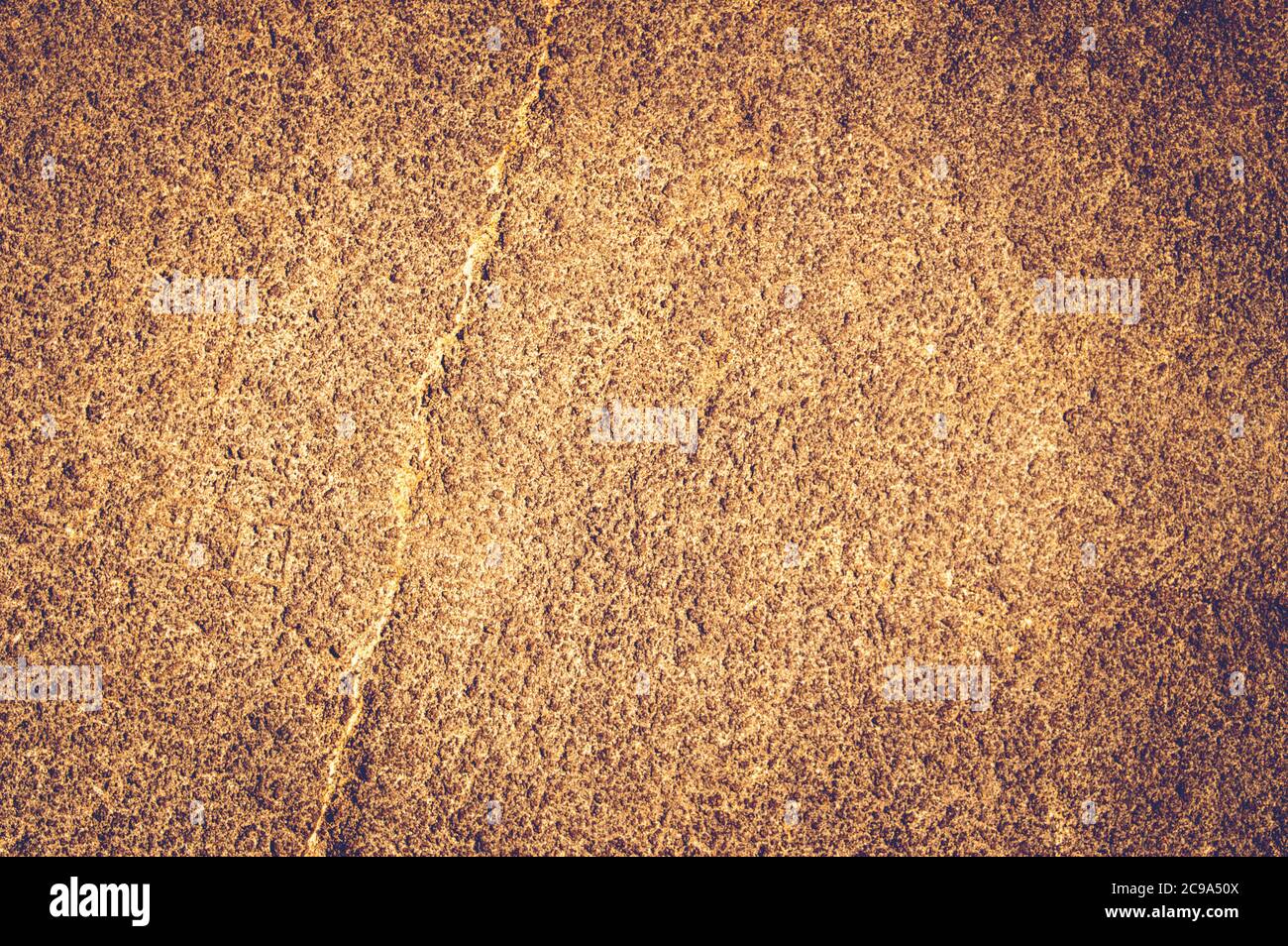 Gold rough vintage stone texture closeup background, copy space background Stock Photo