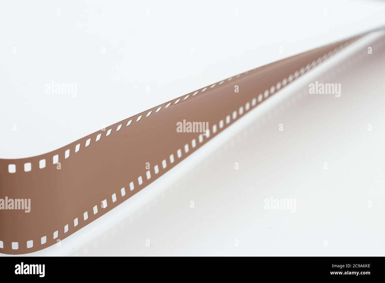 Rolled undeveloped film strip isolated white background Stock Photo Alamy