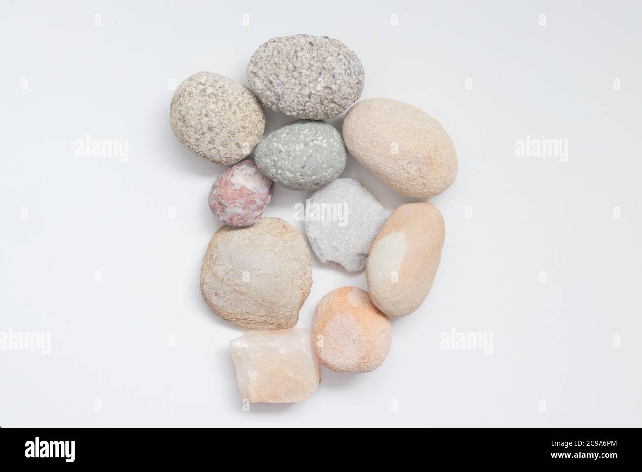 Pile of Decorative Stones and Pebbles on the white background Stock