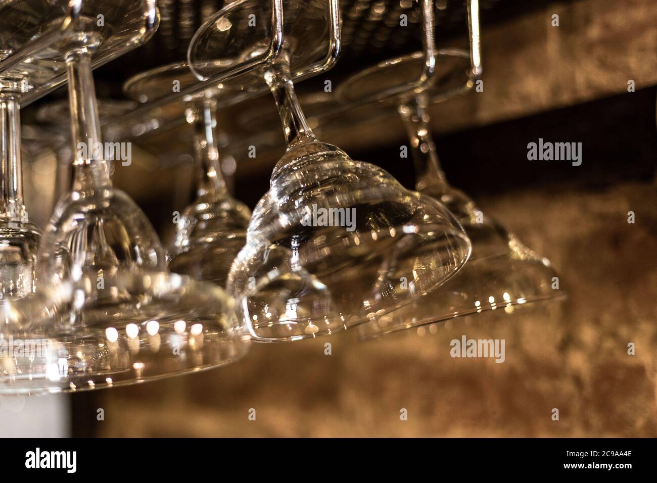 Glass goblets in a bar. Glare and light.  Stock Photo
