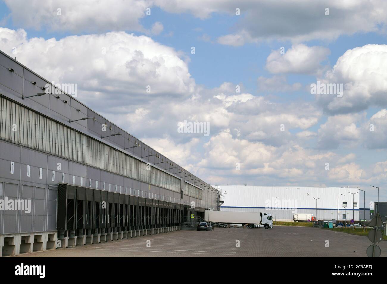 Place loading and unloading  trucks. A truck during unloading in a distribution center. Stock Photo