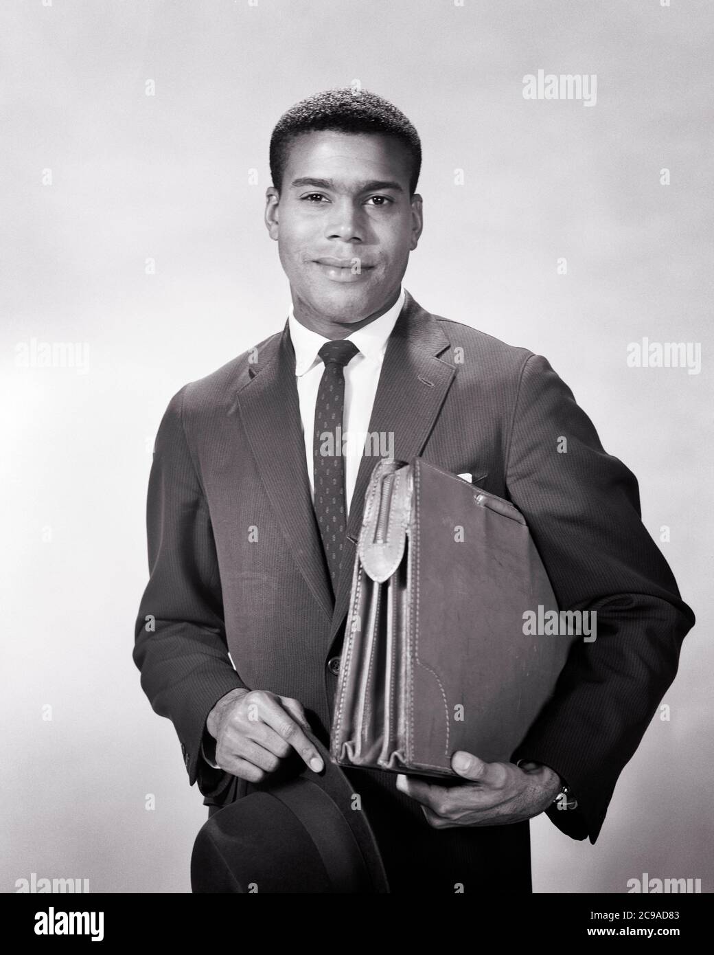 1950s 1960s AFRICAN AMERICAN BUSINESSMAN HOLDING BRIEFCASE UNDER