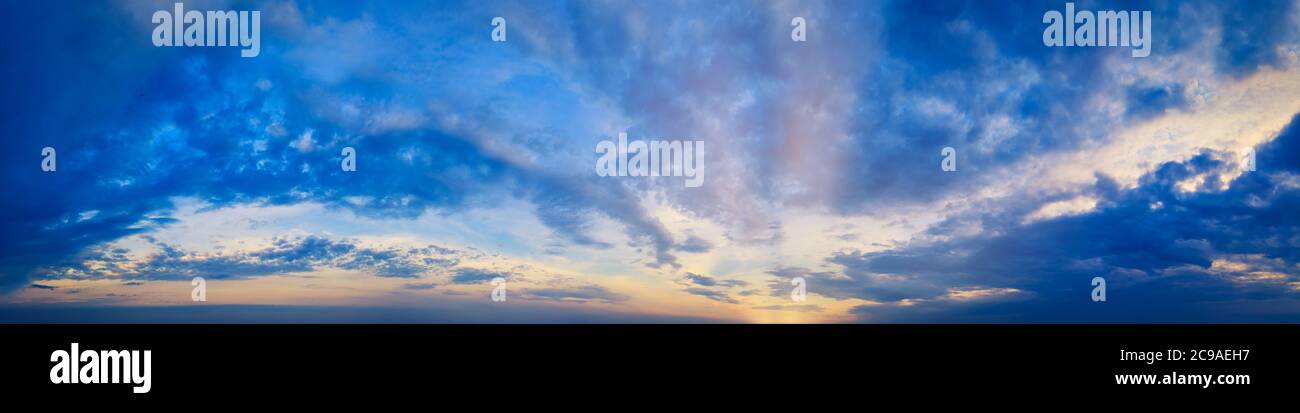 Magical Magnificent Blue Sky panorama at Cloudy sunset with sun rays ...