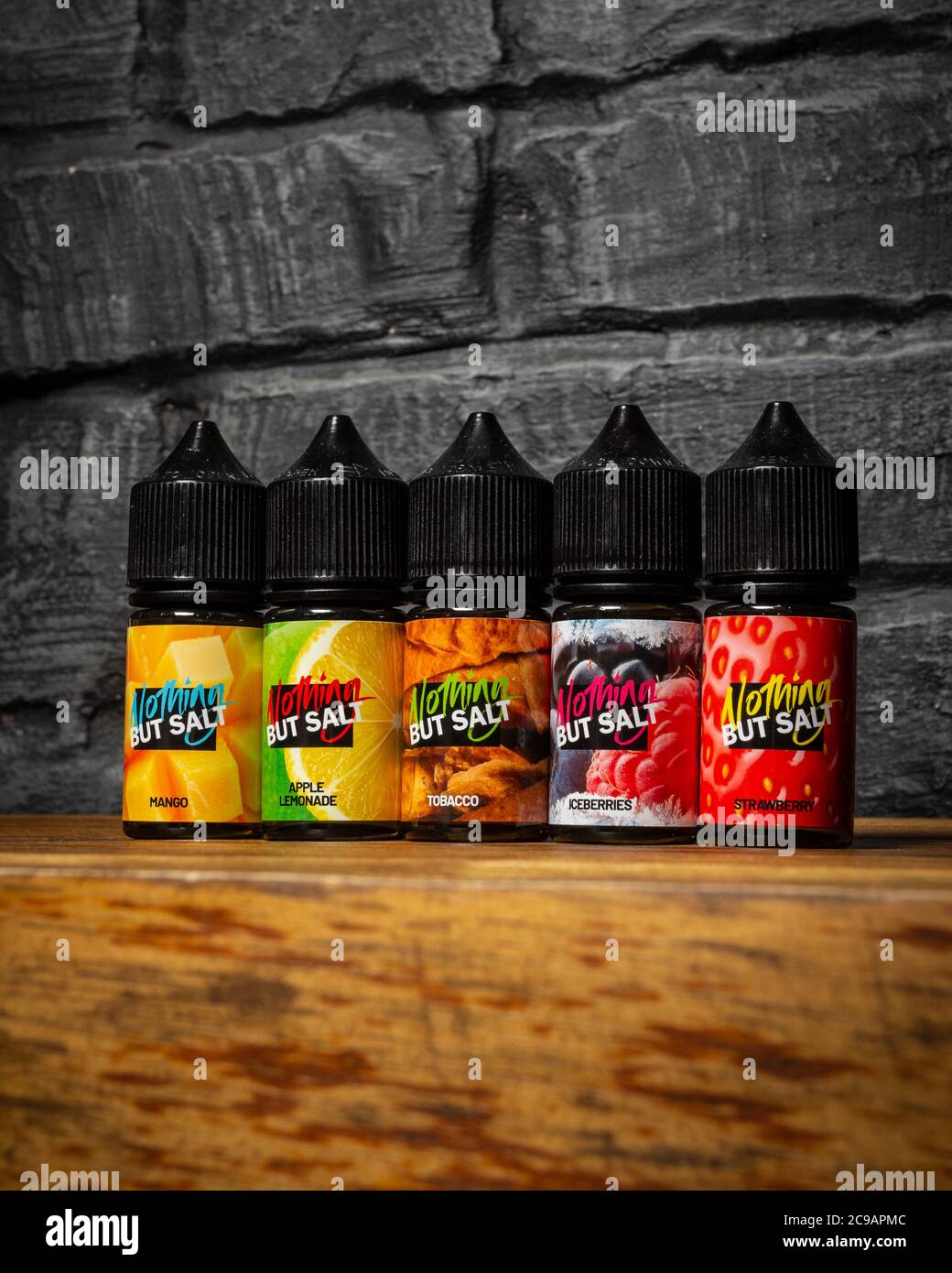 Ufa, Russia, Vape Shop, 3 July, 2019: E-liquid e-juice High vape for  electronic cigarette vaping device , on counter in smoke vapor in vape bar  in Stock Photo