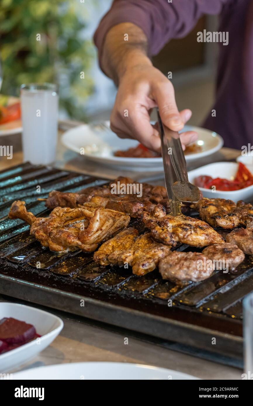 Different types of meat grilled on Barbecue on the table, Served with special Turkish appetizers