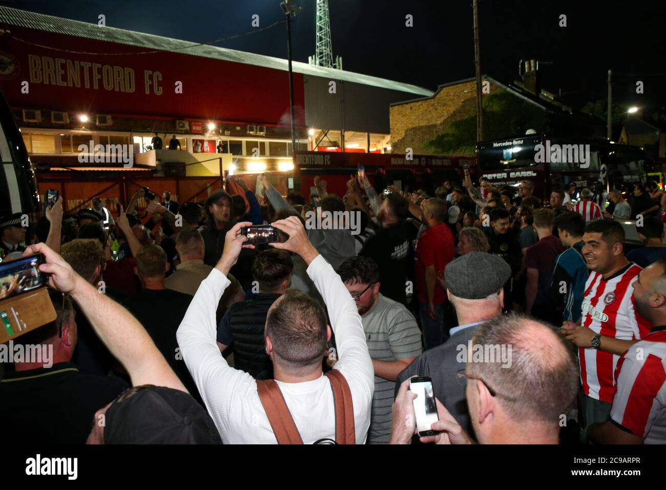 London, 29th July 2020  Supporters celebrate - General View of Griffin Park, Brentford Football Club, on the final night of football at their historic home (Since 1904) before they move to their new ground, Brentford Community Stadium. Andrew Fosker / Alamy Live News Stock Photo