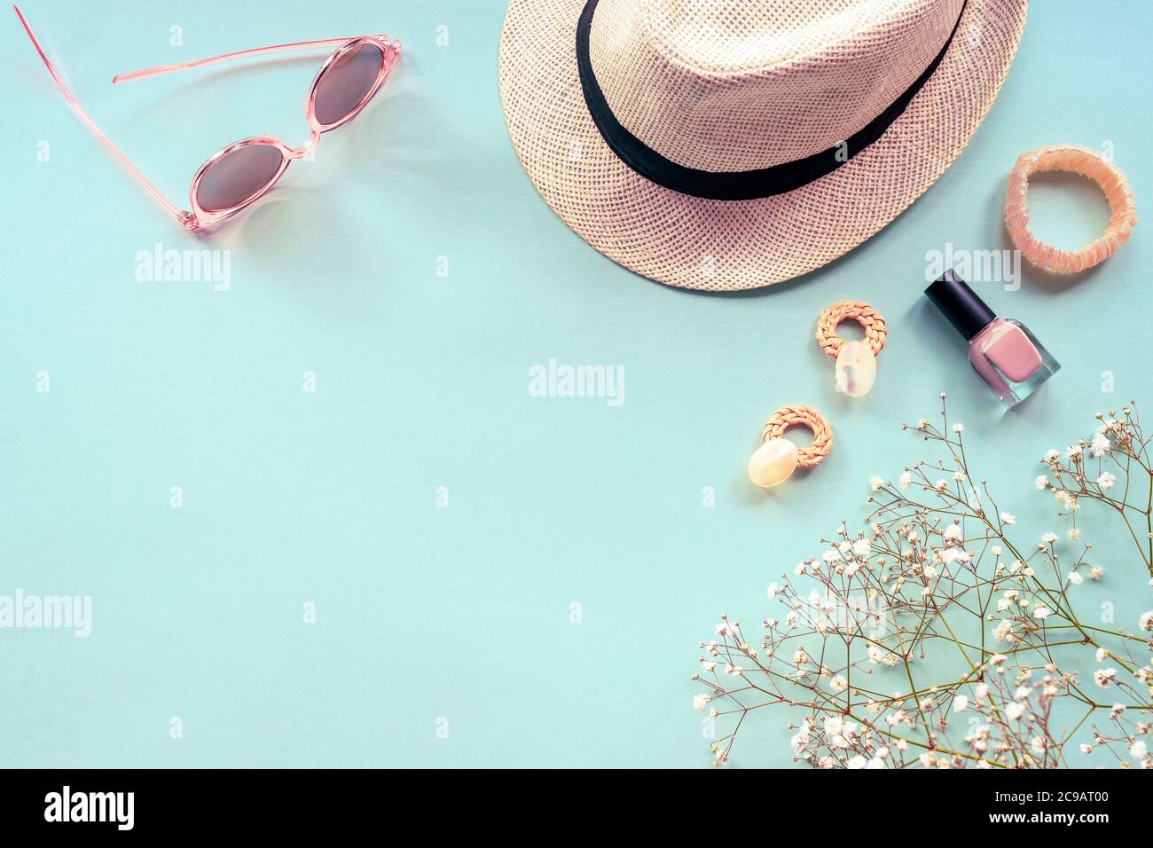 Flat lay with summer accessories for woman. Sun hat, sunglasses