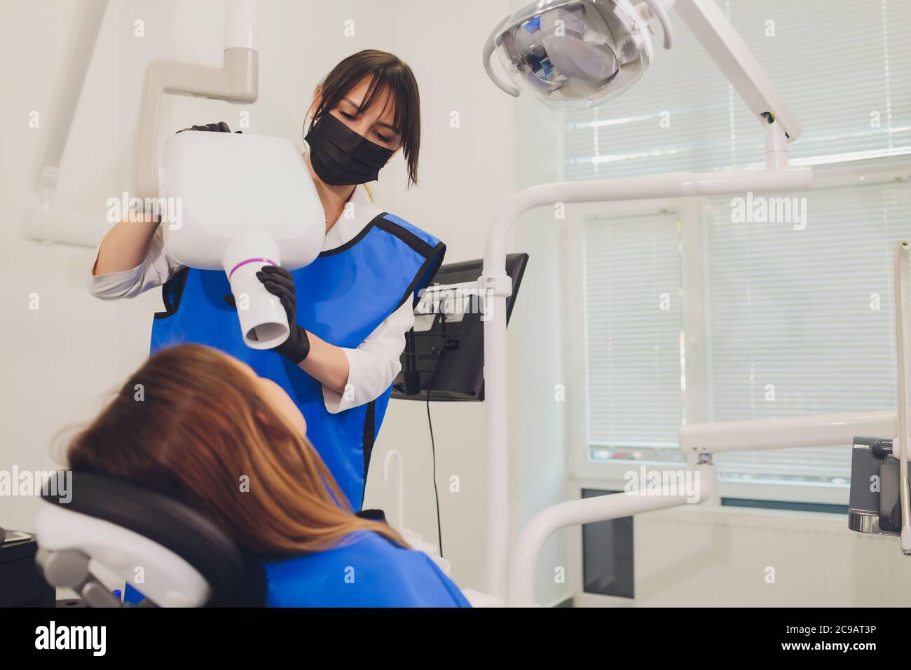 Dentist working with dental polymerization lamp in oral cavity Stock Photo Alamy