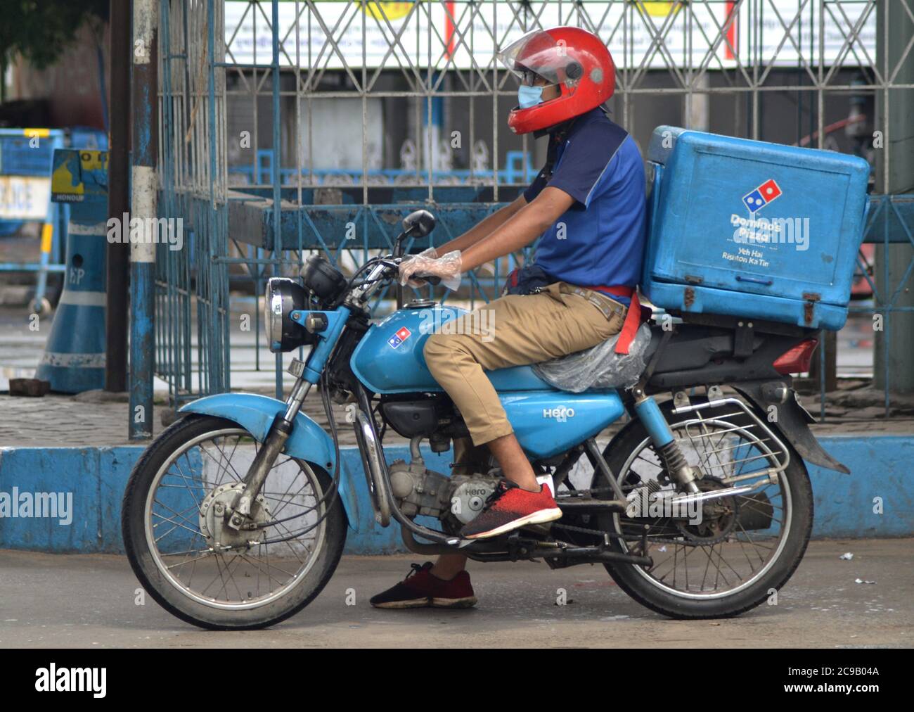 Kolkata, India. 29th July, 2020. A delivery boy of Domino's, working as an emergency duty to deliver the food as early as possible during the periods of State wise Lockdown (Photo by Anubrata Mondal/Pacific Press) Credit: Pacific Press Media Production Corp./Alamy Live News Stock Photo