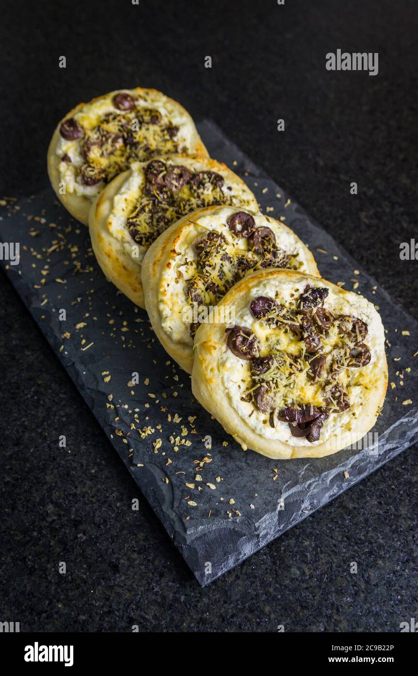 Delicious Lebanese (Arabic) food, Mediterranean ricotta sfiha, olives