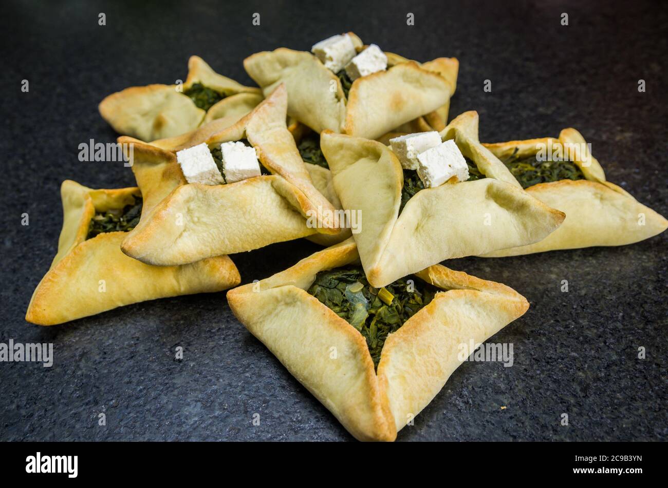 Delicious Lebanese (Arabic) food, spinach sfiha with ricotta cheese on