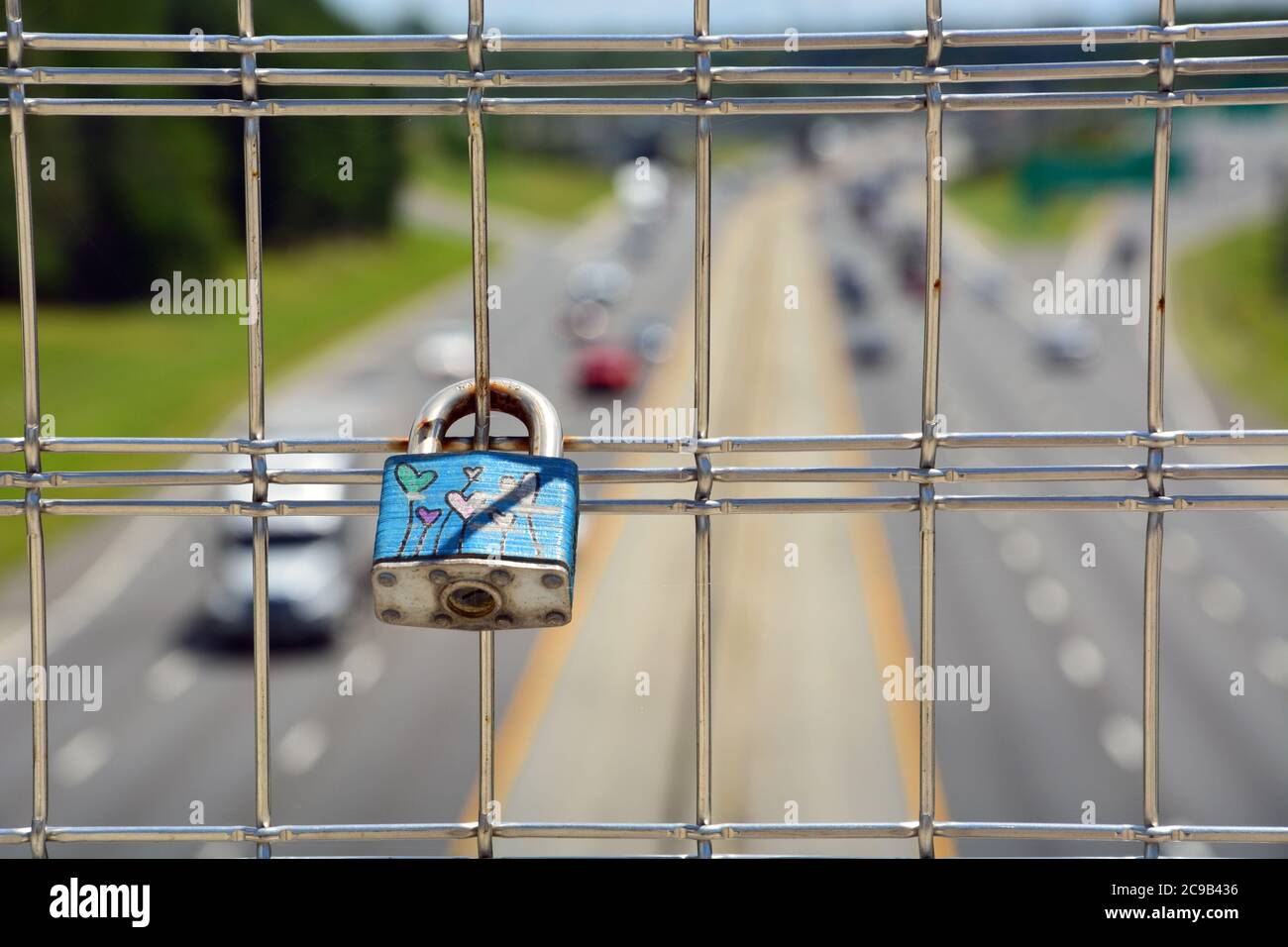 Love locks have started to accumulate on the American Tobacco Trail bridge over Interstate 40 in Durham, NC. Stock Photo