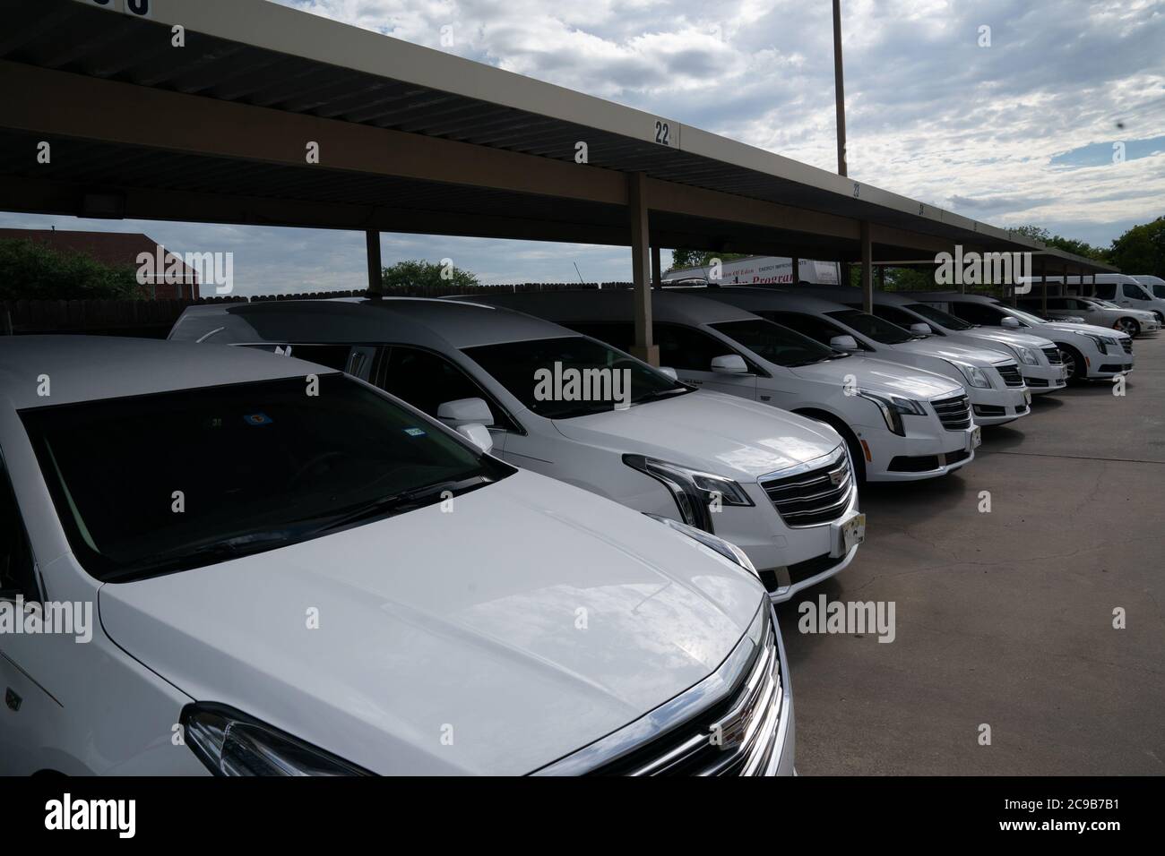 Dallas, TX, USA. 29th July, 2020. Hearses in the parking lot at The Golden Gate Funeral Home in Dallas, Texas on July 29, 2020. Funeral Funeral home director John Beckwith has prepared his staff and operation for an increase in COVID-19 related deaths over the coming weeks. Credit: Bryan Smith/ZUMA Wire/Alamy Live News Stock Photo