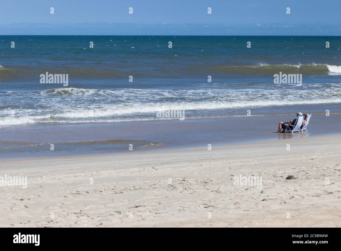 Avon, Outer Banks, North Carolina. Middle-aged Couple Enjoying the Waves on the Beach. Stock Photo