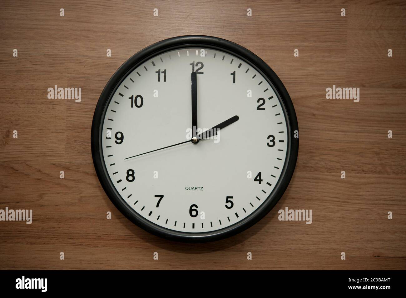 wall clock indicating the two o'clock hour Stock Photo Alamy