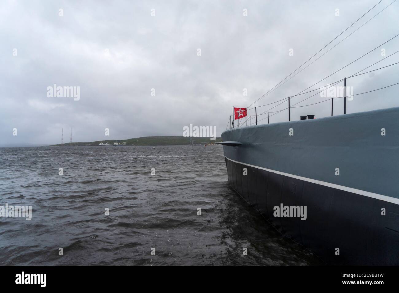 Severomorsk, Russia - August, 2019: View to the bow of the K-21 submarine with red banner flag at the Northern Fleet museum in Severomorsk. Stock Photo