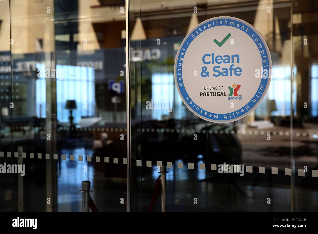 Algarve, Portugal. 29th July, 2020. A 'Clean and Safe' stamp is seen at a Hotel door in Portimao, Algarve region, Portugal on July 29, 2020. Considering the widespread concern in the resumption of economic and social activity, Turismo de Portugal created a 'Clean and Safe' stamp of approval to distinguish tourist activities which are compliant with hygiene and cleaning requirements for the prevention and control of COVID-19 and other possible infections. Credit: Pedro Fiuza/ZUMA Wire/Alamy Live News Stock Photo