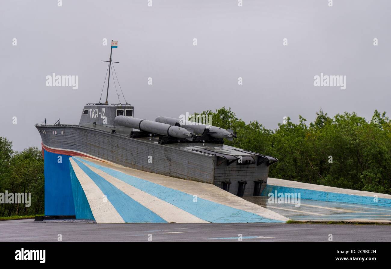 Severomorsk, Russia - August, 2019: Monument in honor to marines served in the World Second War. Legendary torpedo boat TKA-12 on blue pedestal. Stock Photo
