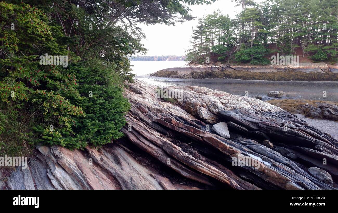 Wolfe's Neck Woods State Park, located on the peninsula in Casco Bay, coastal rock formations, view at sunset Stock Photo
