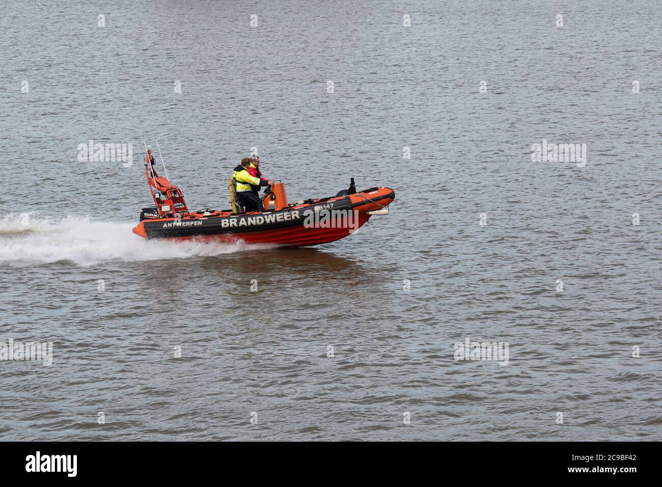 Antwerp, Belgium, July 19, 2020, Rescue boat of the fire brigade with two people on board Stock Photo