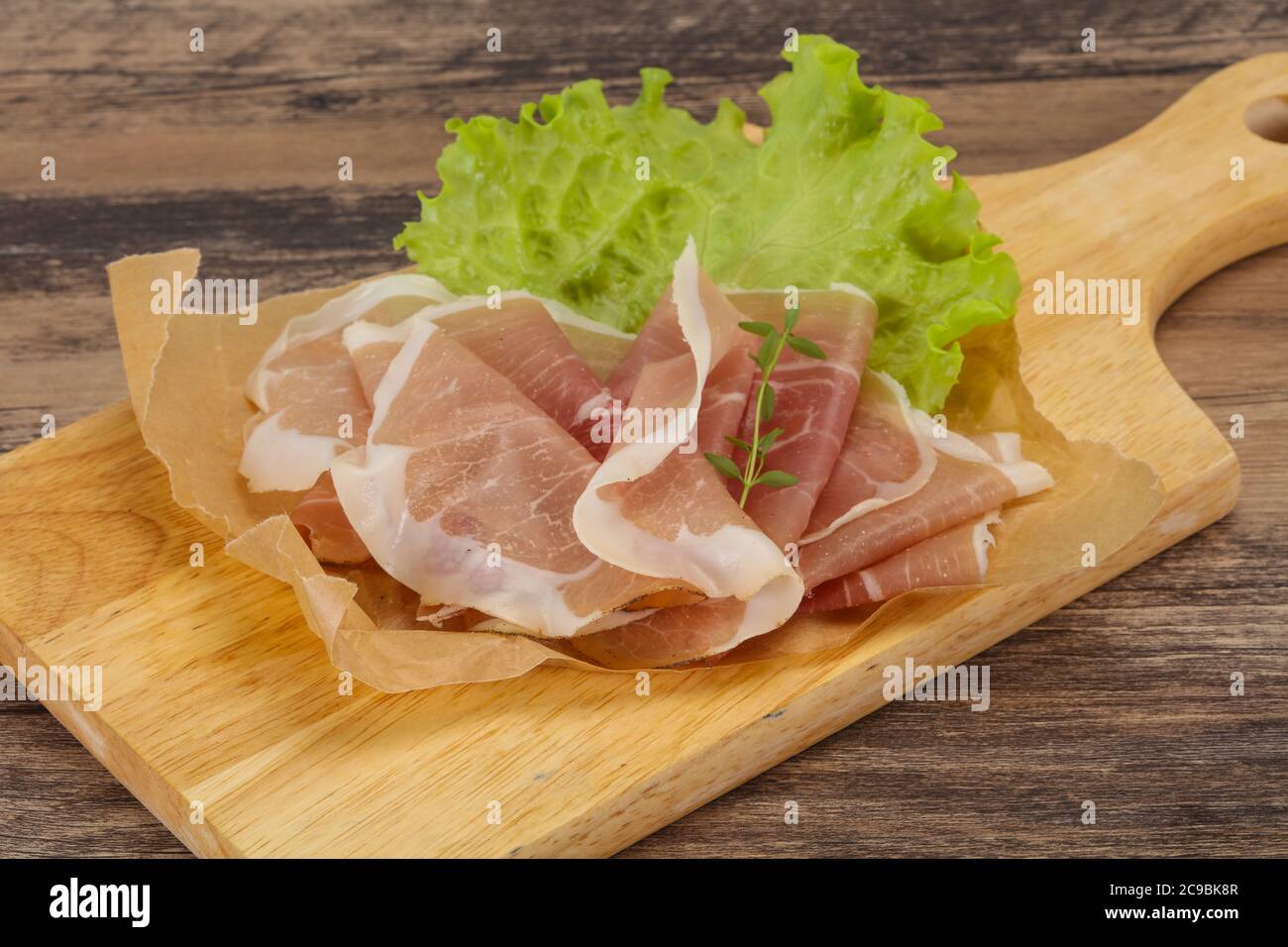 Italian prosciutto pork meat snack over board Stock Photo Alamy