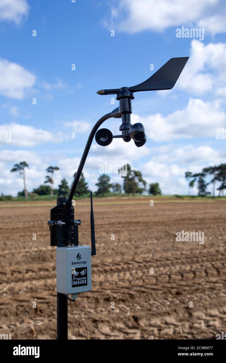 Sencrop Windcrop V7 weather vane anemometer weather station equipment in farm field, Sutton, Suffolk, England, UK Stock Photo
