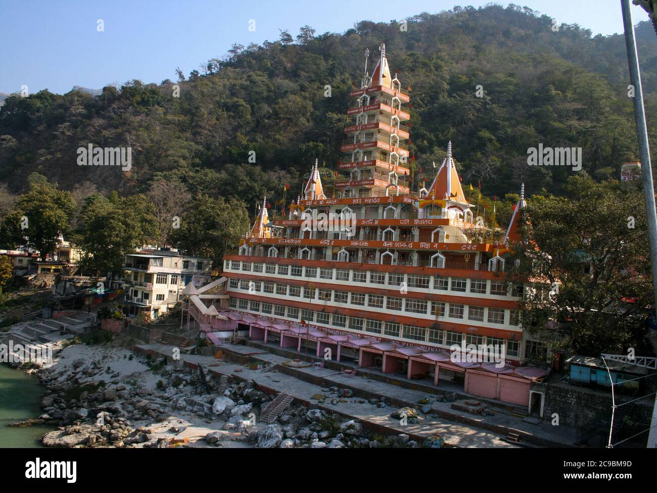 Lakshman Jhula is a suspension bridge across the river Ganges, Rishikesh and Haridwar are popular tourist destination termed as twin heritage cities Stock Photo