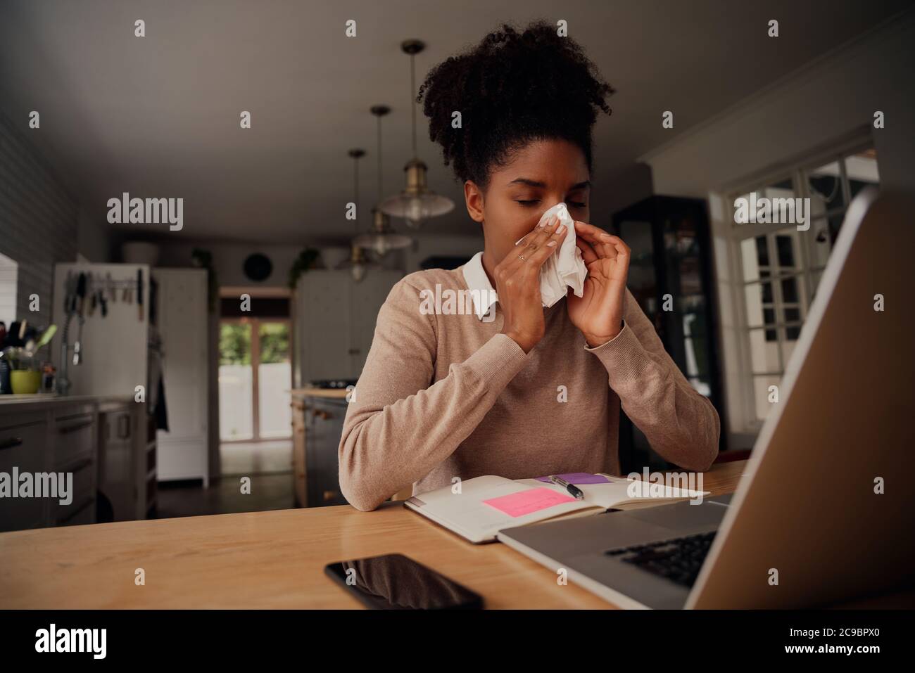 Sick exhausted young woman suffering from cold virus and coughing using