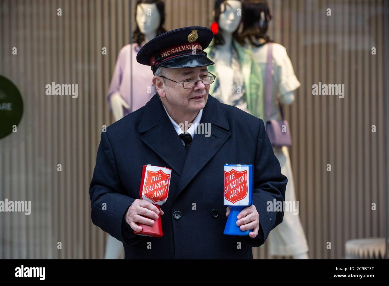 Salvation Army volunteer collecting money for the chairs on Oxford Street, London, England, United Kingdom Stock Photo