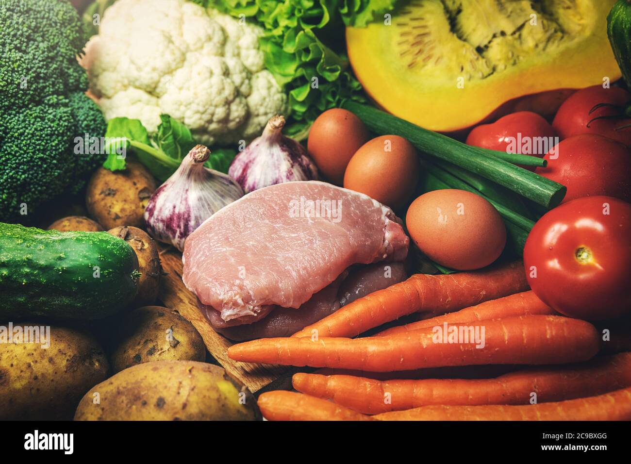 fresh healthy organic food from local farmer- group of vegetables, meat and eggs Stock Photo