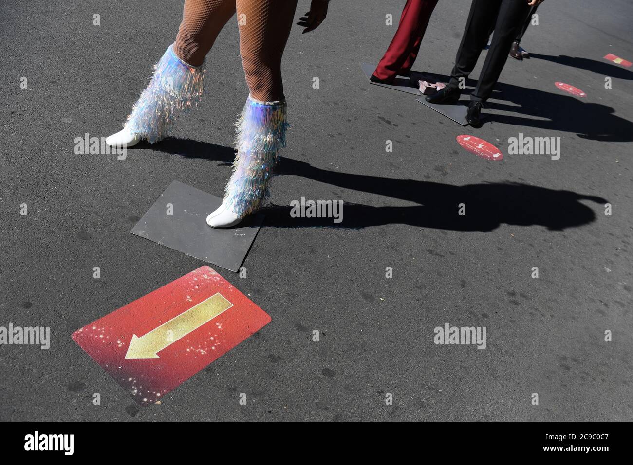 A detail of the feet of a wax figure of Beyonce, standing on a social distancing marker in the entrance line at Madame Tussaud's in London, as the attraction prepares to reopen to the public following the easing of lockdown restrictions in England. Stock Photo