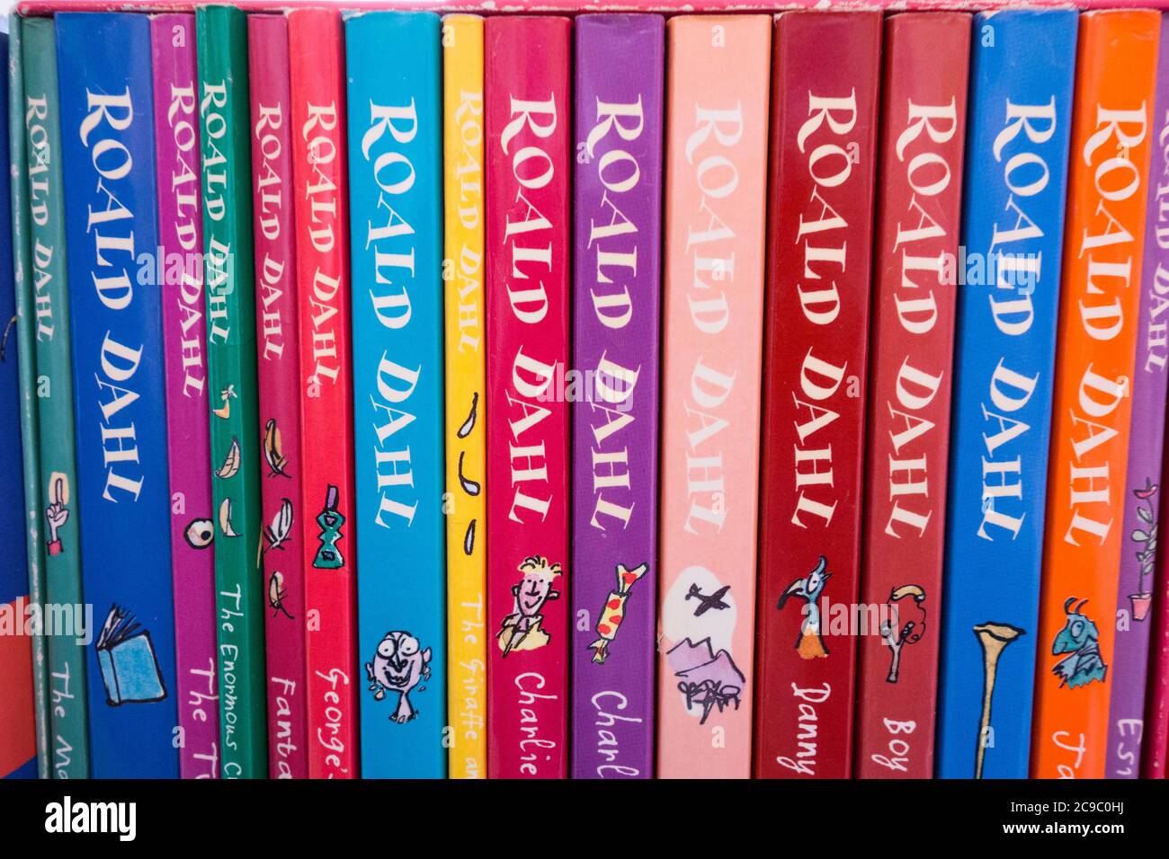 Closeup of colourful Roald Dahl book covers, spines, illustrations and artwork Stock Photo
