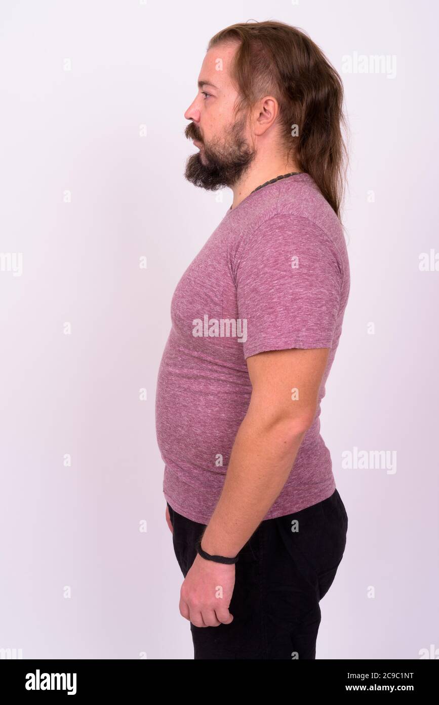 Bearded man with mustache and long hair against white background Stock Photo