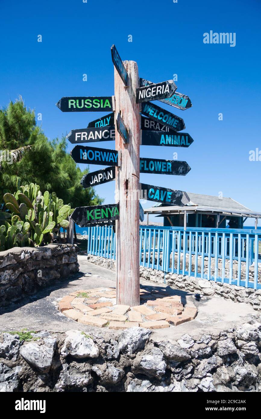 Signpost at North Point on the island of Barbados indicates the direction to international places Stock Photo