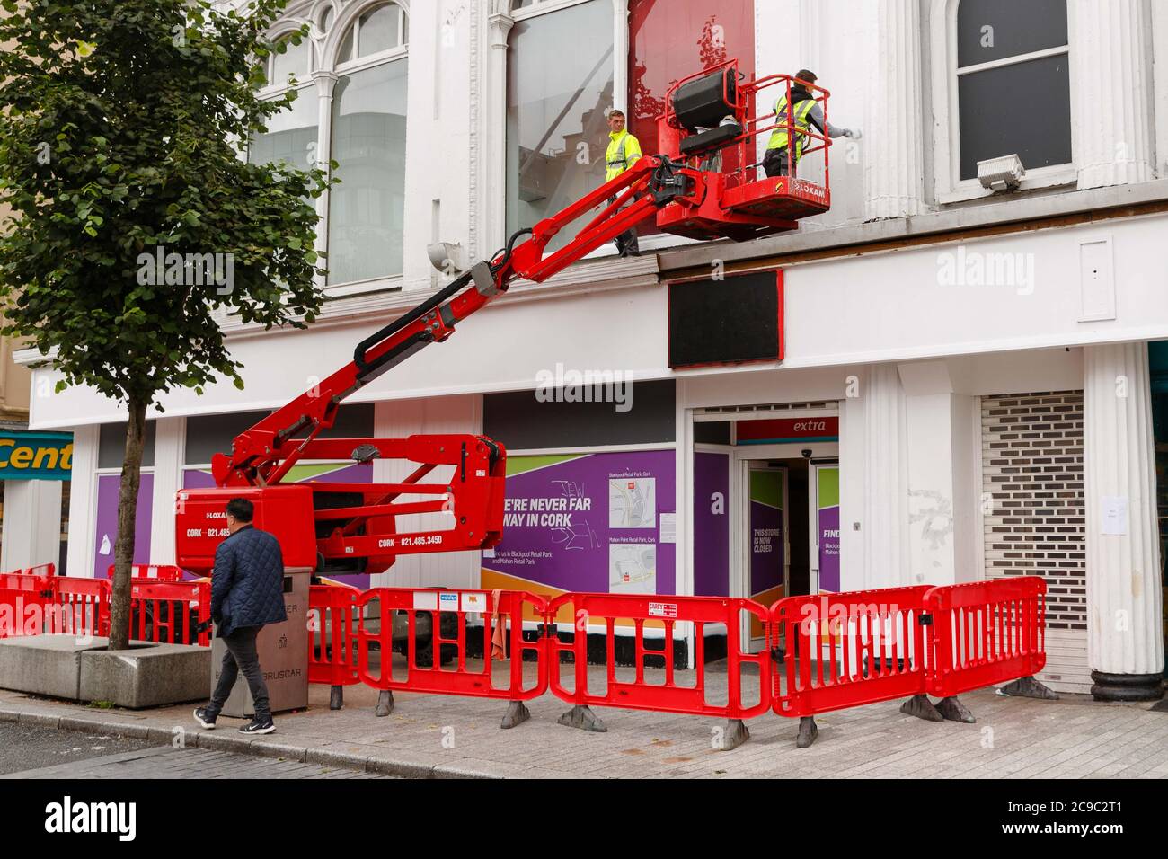 Cork, Ireland. 30th July 2020. Queens Old Castle, Cork City. Workers painting the former Argos Unit at Queens Old Castle Cork. Credit: Damian Coleman/Alamy Live News Stock Photo