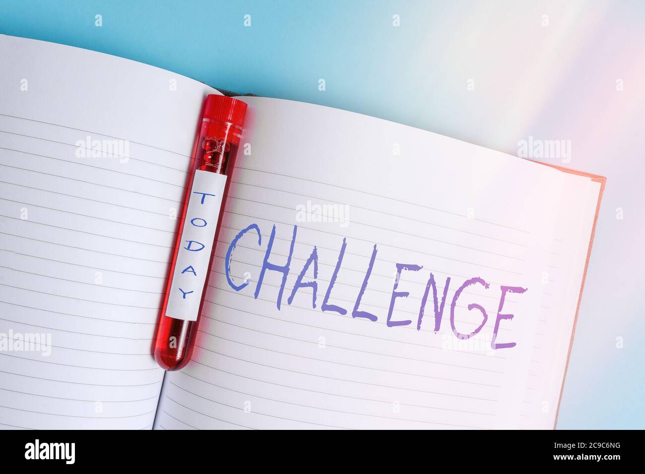 Writing note showing Challenge. Business concept for process of provoking or testing physiological activity by exposure Blood sample vial medical acce Stock Photo