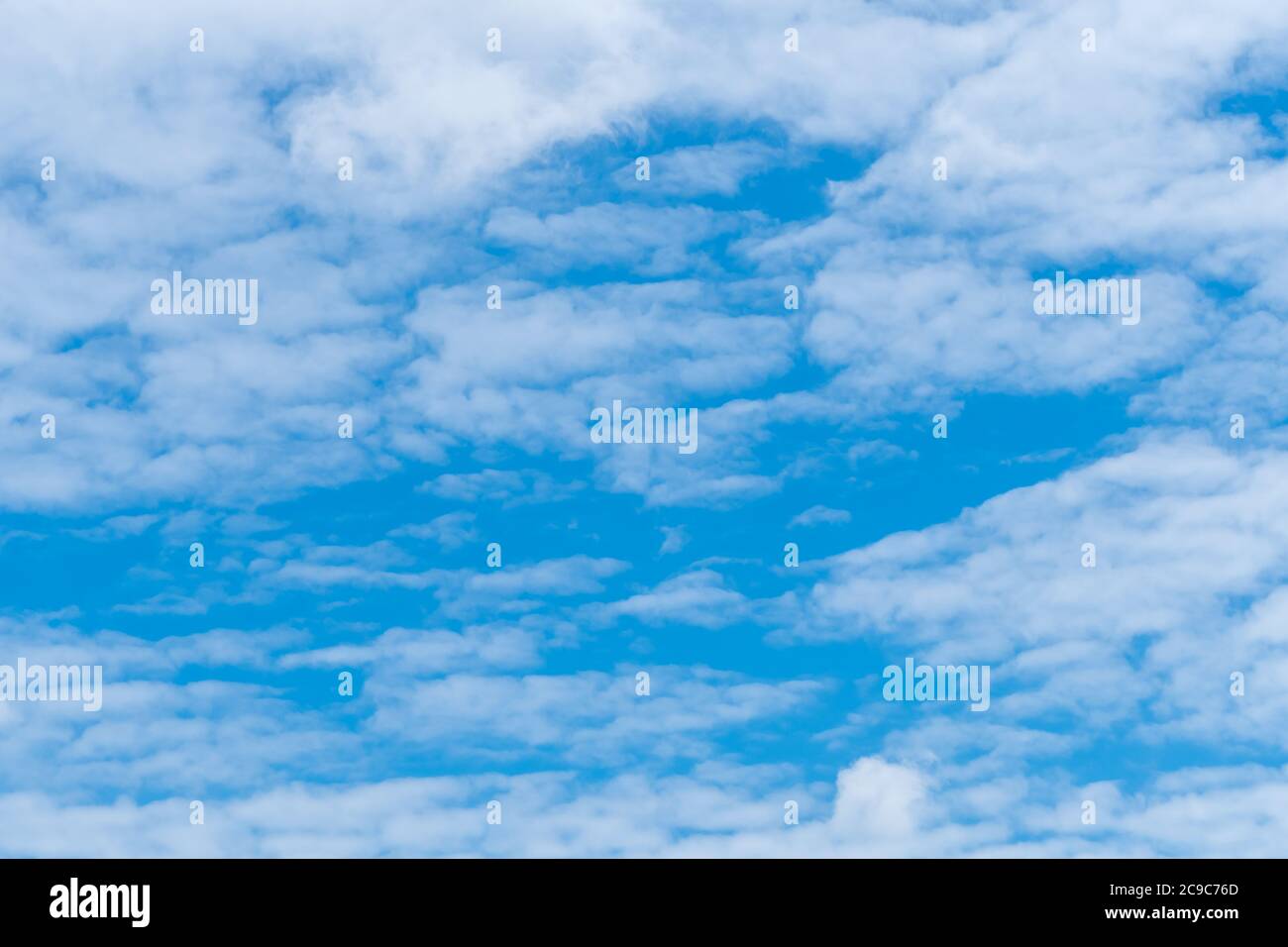 White fluffy clouds on blue sky. Soft touch feeling like cotton. White puffy clouds cape with space for text. Beauty in nature. Close-up white cumulus Stock Photo