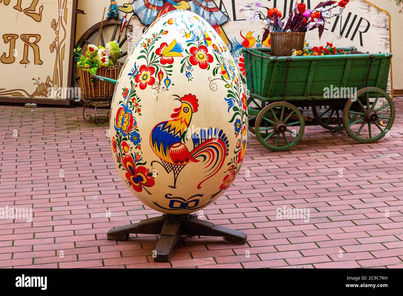 Giiant colourful painted traditional Easter Egg decorated with cockerel and flowers, Old Town Prague ,Czech Republic, Europe Stock Photo