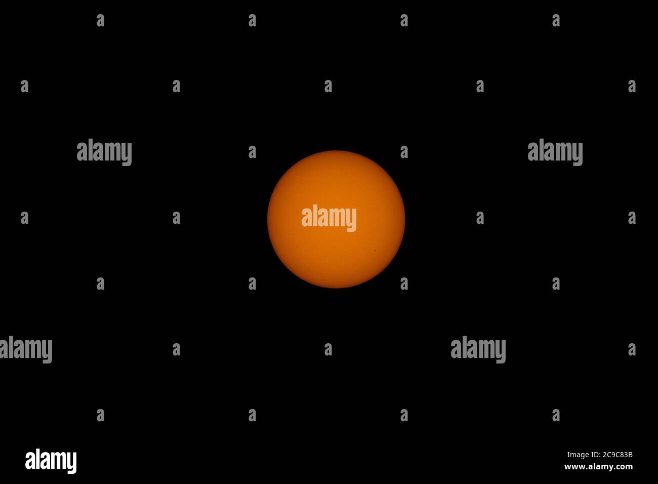 London, UK. 30 July 2020. Telescope image of the sun viewed with white  light solar filter showing new small sunspots AR2767 (lower right) and  AR2768 (upper left), both in Solar Cycle 25