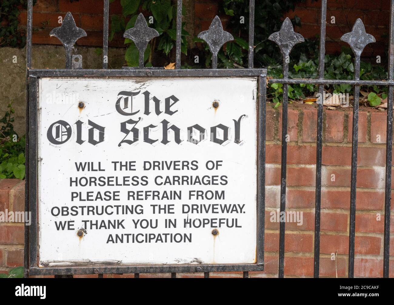 Amusing sign - no parking notice - in the Hampshire village of Charlton, Hampshire, England, UK Stock Photo