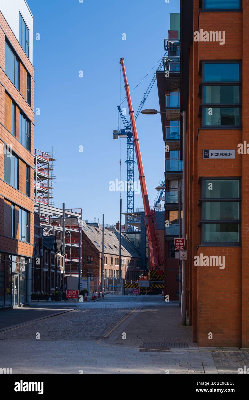 Building development around Cotton Street, Ancoats, Manchester. Balconies overlooking the building work. Stock Photo