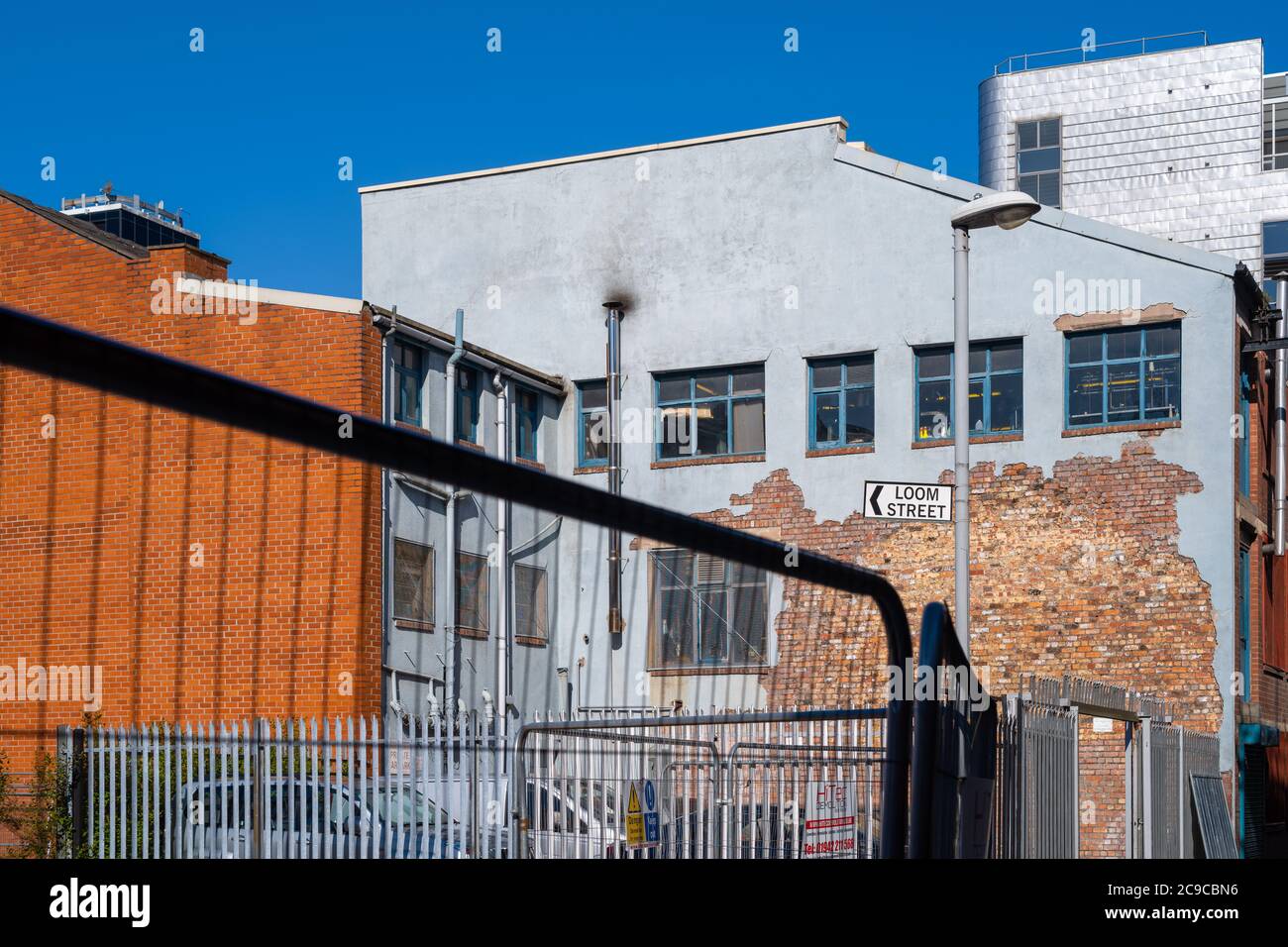 Original red brick revealed in building in Loom Street, Ancoats, Manchester, UK. Ancoats - the cradle of the Industrial Revolution. Stock Photo