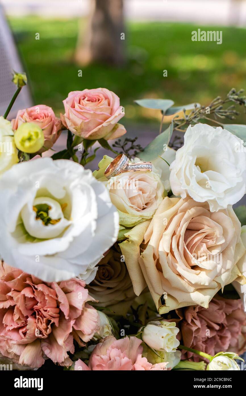 A beautiful bouquet for the bride of white and pink roses. Wedding day, floristry, flowers Stock Photo