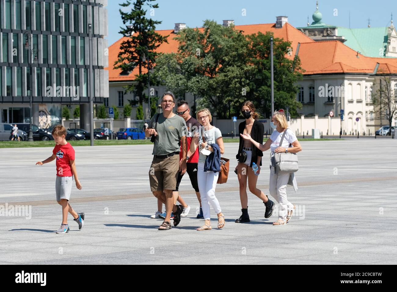 Warsaw, Poland - Thursday 30th July 2020 - Tourists in the city centre, some wearing facemasks others not -  The number of new cases reported today was 615 the highest ever daily infection figure for Poland as Europe worries about a second wave of Coronavirus infections. Photo Steven May / Alamy Live News Stock Photo